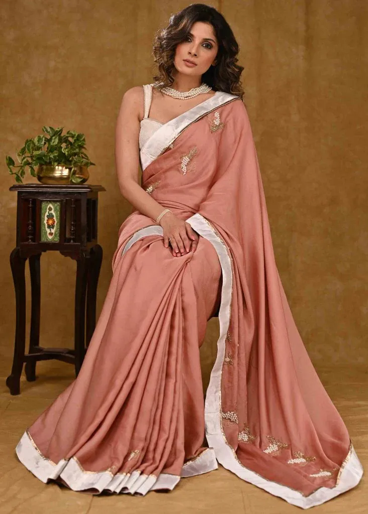 Light Peach Chinnon Saree With Fine Embroidery And White Satin Border