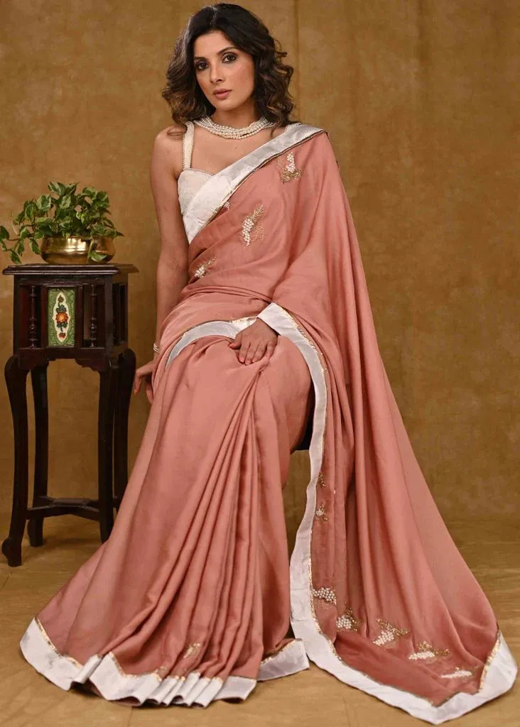 Light Peach Chinnon Saree With Fine Embroidery And White Satin Border